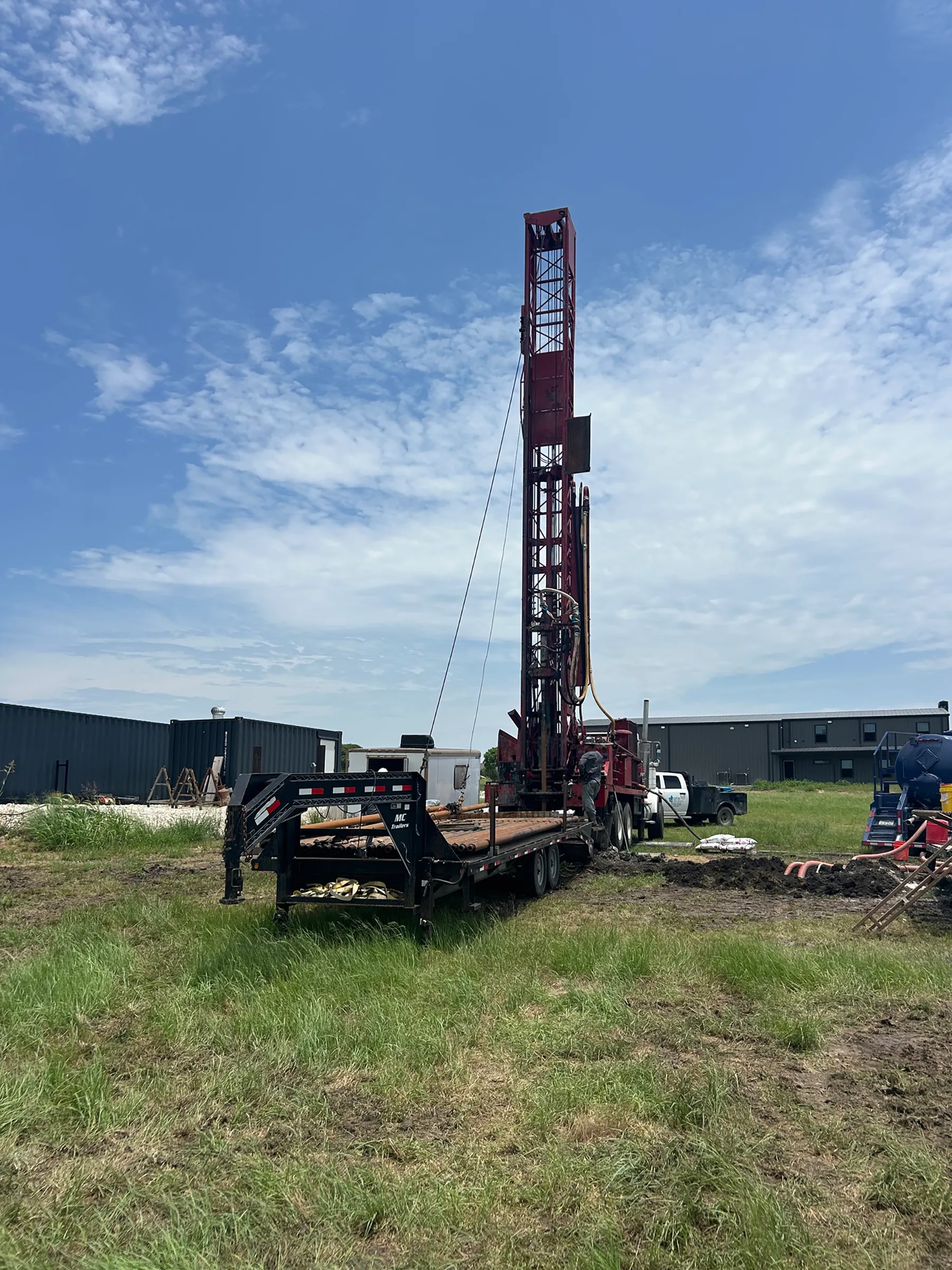 DFW Well Service drilling rig at a commercial job site in North Texas