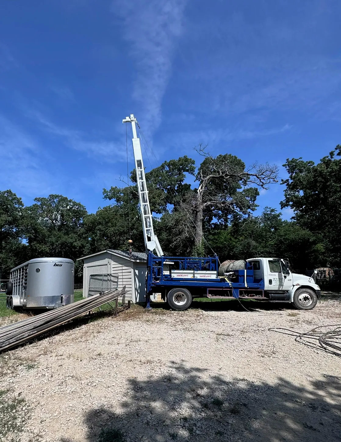 DFW Well Service rig truck on a rural North Texas property