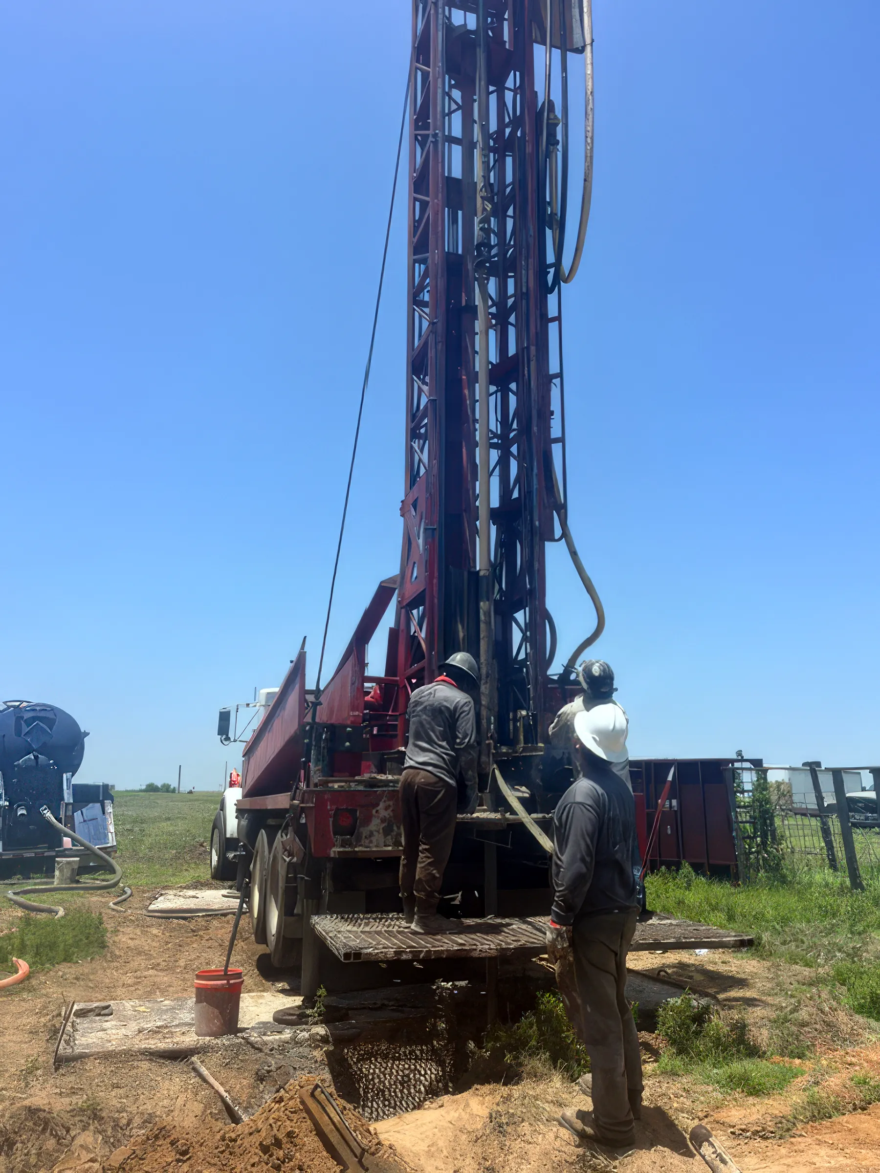 DFW Well Service crew running a water well drilling rig near Chico, TX